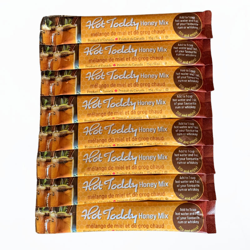 Eight Tu-Bees Hot Toddy Honey Mix packages on a white background