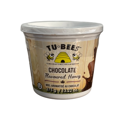 A 375g tub of Tu-Bees Chocolate flavoured honey on a white background