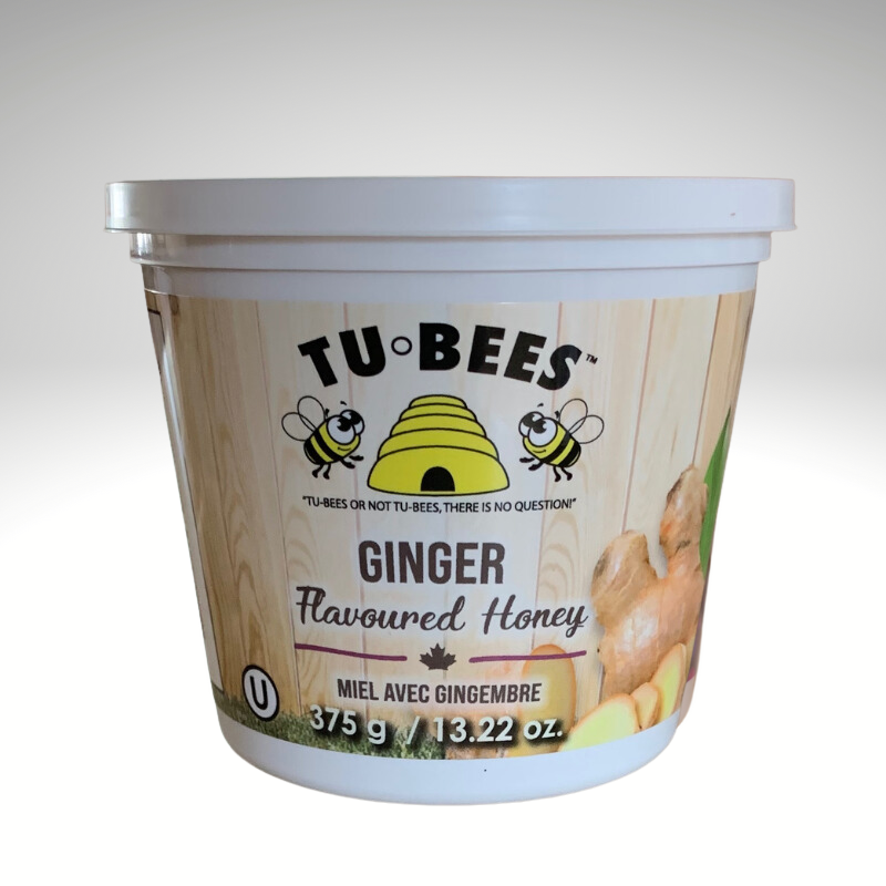 A 375g tub of Tu-Bees Ginger flavoured honey with a white background
