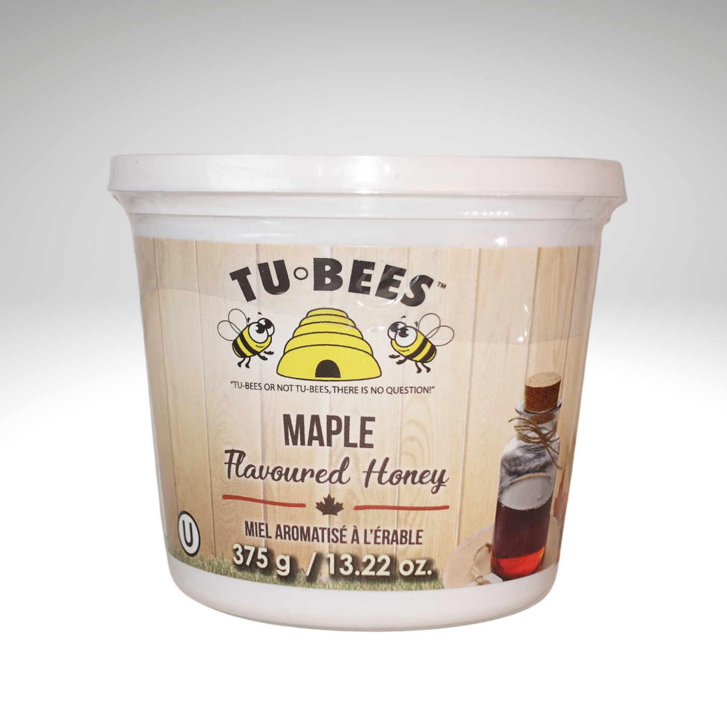 A 375g tub of Tu-Bees Maple flavoured honey, OU Kosher, Product of Canada on a white background